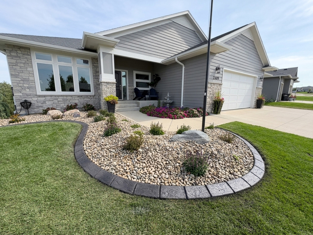 Full-perimeter front-yard bed in light gray